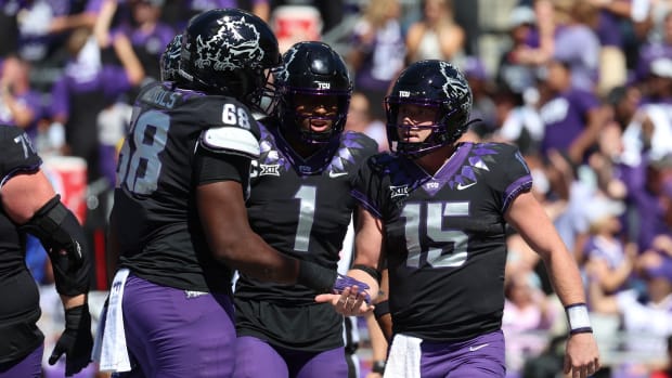 Oct 1, 2022; Fort Worth, Texas, USA; TCU Horned Frogs quarterback Max Duggan (15) celebrates with TCU Horned Frogs wide receiver Quentin Johnston (1) and TCU Horned Frogs offensive tackle Michael Nichols (68) after scoring a touchdown during the second half against the Oklahoma Sooners at Amon G. Carter Stadium. Mandatory Credit: Kevin Jairaj-USA TODAY Sports